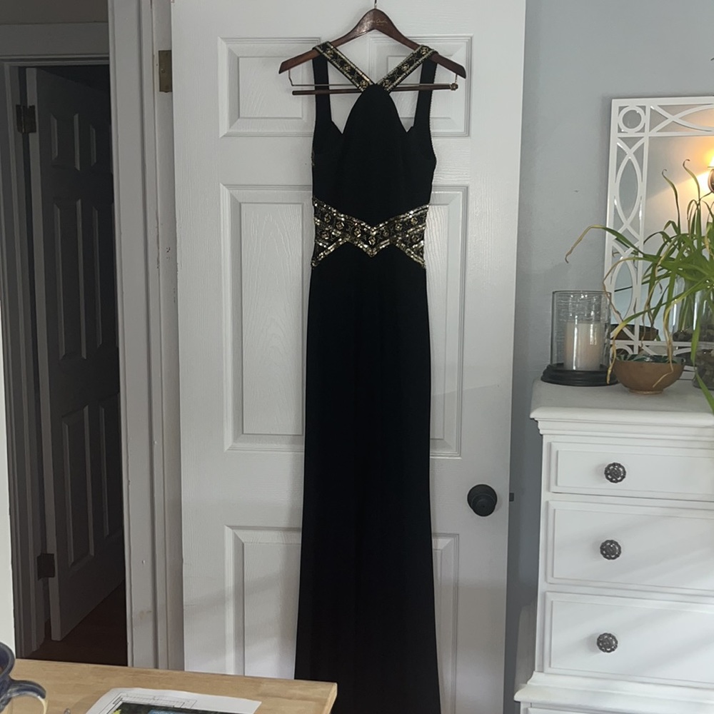 Black floor length dress with gold accent beading